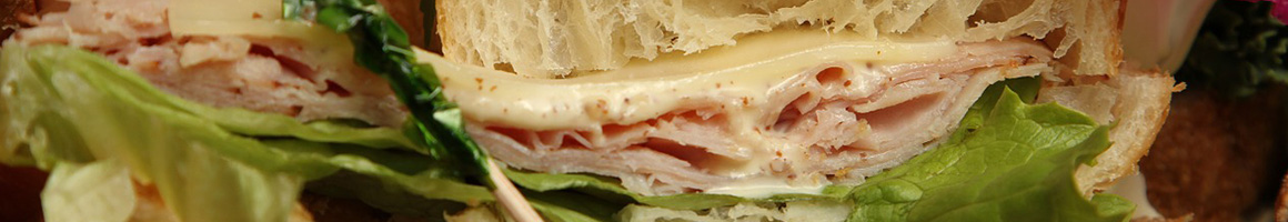 Eating Sandwich Cheesesteak at Charleys Cheesesteaks restaurant in Gurnee, IL.